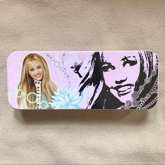 Hannah Montana Tin Pencil Case! Officially Licensed Disney Item From The Tin Box Company Pink/Purple Pencil Case Featuring Two Close-Up Pictures Of Hannah Montana On The Front The Back Features The Iconic Sparkly Hannah Montana Logo Great Item For Any Disney Fan Or Collector!! Or For Any Miley Cyrus Stan Measures 8” X 3” X 1” Perfect Size For All Of Your Pencils, Pens, Markers, Erasers, And Sticky Notes! :-) Brand New, Never Used! Will Come Carefully Bubble Wrapped!!! Hannah Montana Logo, Purple Pencil Case, Multi Color Pen, Alien Plush, Zipper Pencil Case, Disney Frozen Olaf, Box Company, Disney Sleeping Beauty, Vintage Disneyland