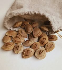 almonds with the letters x and y on them are in a drawstring bag