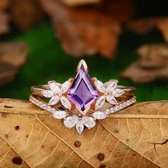 Engagement Ring Metal Type: 925 Sterling Silver, Soild 10k Gold, Solid 14k Gold, Solid 18k Gold Center Stone: Natural Amethyst Center Carat Weight: Kite Cut 1.35CT (6*9mm) Side Stones: Moissanites 0.45ctw (DEF, VVS1)  Band Width: 1.35mm Wedding Ring Side Stones: Moissanites - 0.36ctw (DEF, VVS1)  Band Width: 1.35mm SKU: YFXR0532+YFXR0532-B-amethyst Accessories: *Shipped with beautiful ring box; *Directly price from Manufacturer, 1/3 the price from Jewelry Store; - Ethically Sourced Heirloom Amethyst Jewelry With Rose Cut Diamonds, Rose Cut Amethyst Jewelry For Wedding, Purple Amethyst Jewelry With Rose Cut Diamonds, Anniversary Amethyst Gemstone Flower Ring, Amethyst Gemstone Flower Ring For Anniversary, Marquise Amethyst Jewelry For Anniversary, Amethyst Accessories, 35mm Wedding, Gold Sunburst