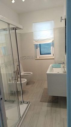 a bathroom with a tub, toilet and sink