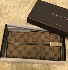 Auth Gucci Fold Purse #7210 Long Wallet   GG Brown Canvas Leather Italy  Description Condition: B (Good Condition But Signs of Small Scratches and / or Stains) Accessory: Box Color Brown Size (Approx): W 19cm H 9.5cm D 2.5cm Size (Approx) : W 7.49inch H 3.75inch D 0.99inch Condition: B  N : (New)  S : (Almost brand new)  A : (Great condition Light signs of use with tiny scratches and/or stains)   B : (Good condition but signs of small scratches and/or stains)  C : (Noticeable signs of use with s Classic Gucci Wallet For Travel, Classic Gucci Travel Wallet, Gucci Brown Formal Wallet, Formal Brown Gucci Wallet, Gucci Brown Wallet With Card Slots, Classic Gucci Bifold Wallet, Luxury Brown Gucci Wallet, Classic Gucci Rectangular Wallet, Gucci Bifold Wallet With Original Box