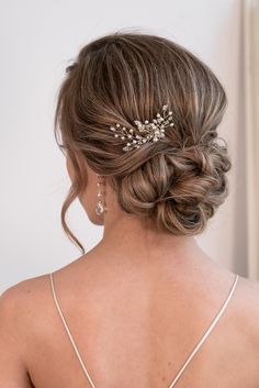 the back of a woman's head wearing a hair comb