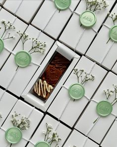 the chocolate is decorated with flowers and waxed labels on it's packaging boxes