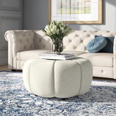 a living room scene with focus on the ottoman