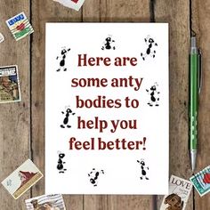 there are some stamps and pencils on the table next to a card that says, here are some any bodies to help you feel better