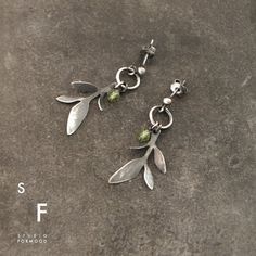 Earrings are made of oxidized silver 925 and peridot, coral .... Dimensions:The whole length: 1.38 inches  (3.5 cm)Silver elements  : 0.98" - 1.18" ( 2.5 mm)Single earring's weight: 1.25 gThe weight and length may vary slightly  depending on the earwire typeThank you for visiting! Green Sterling Silver Earrings With Oxidized Finish, Green Oxidized Finish Earrings For Gift, Hand Forged Green Earrings For Gift, Modern Silver Earrings, Basic Jewelry, Hippie Earrings, Garnet Earrings, Small Earrings, Modern Earrings