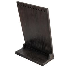 a wooden stand with holes in the middle on a white background for text or image