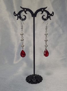 Silver spiral beads with beautiful Ruby red rhinestone Red Black Accessories, Blood Drip Earrings, Red Silver Earrings, Red Dangly Earrings, Gothic Jewelry Earrings, Ruby Jewelry Silver, Goth Prom Jewelry, Red And Silver Earrings, Red Silver Jewelry