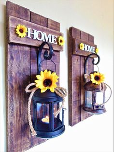 two sunflowers are hanging on the wall next to a lantern and some other decorations