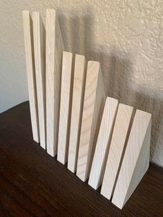 several pieces of wood sitting on top of a wooden table