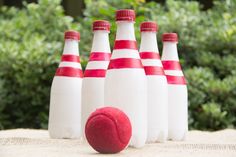 a group of red and white bowling pins sitting next to each other