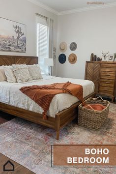 a bed room with a neatly made bed next to a dresser and mirror on the wall