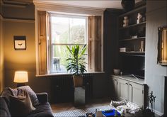 a living room filled with furniture and a fire place