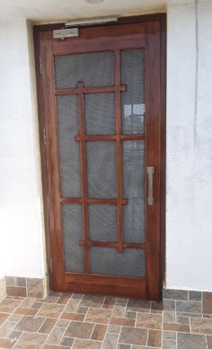 a wooden door with glass on the outside