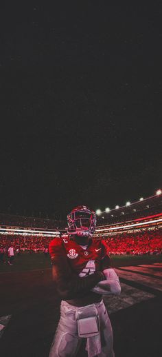 a football player is standing on the field