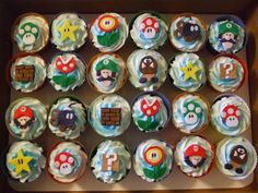 the cupcakes are decorated with mario bros characters