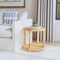 a living room with a white couch and table