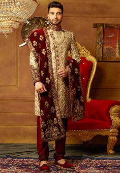 Readymade Art Silk Sherwani in Light Beige This attire with Satin lining is Hand Embroidered with Zari, Stone, Sequins, Bullion, Applique, Buttons and Cutbeads Work Crafted in Chinese Collar and Full Sleeves Available with an Art Dupion Silk Churidar in Maroon and a Velvet dupatta in Maroon Do note: Necklace, Accessories and Footwear shown in the image are for presentation purposes only. Half to one inch may vary in measurement. (Slight variation in actual color vs. image is possible). Orang India, Indian Groom Dress, Portraits Painting, Sherwani For Men Wedding, Wedding Kurta, Groom Dress Men, Wedding Outfits For Groom, Indian Groom Wear, Wedding Dresses Men Indian