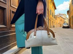 Vintage Vintage 1970s . Beige leather handbag for woman, Made in Italy. A very interesting bag for true connoisseurs of vintage and rarity 1970s. Vintage clutches are a trendy accessory that gives style and status to the owner. Condition: satisfactory Small leather coin wallet purse inside (on chain) Defects - on the leatherette lining a little torn near the pocket on the corner On the clasp the leather is slightly delaminating I collect vintage jewelry and also create unique jewelry from rare m Retro Beige Satchel For Shopping, Retro Beige Shoulder Bag For Formal Occasions, Vintage Beige Shoulder Bag For Formal Occasions, Beige Retro Shoulder Bag For Formal Occasions, Formal Retro Beige Shoulder Bag, Cream Vintage Shoulder Bag For Everyday Use, Vintage Cream Shoulder Bag For Everyday, Vintage Beige Handheld Shoulder Bag, Vintage Beige Formal Shoulder Bag