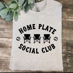 a t - shirt that says home plate social club with two lawn chairs on it