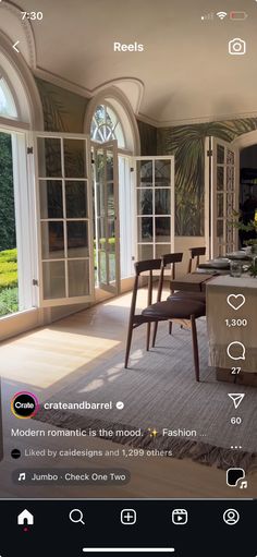 an image of a living room and dining area with furniture on the floor in front of large windows