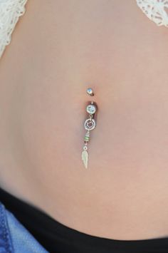 "A one of a kind belly button ring full of boho-chic style! Handmade of a Sterling Silver barbell, dreamcatcher and feather pendants, and Swarovski beads. Quality meets style for the hottest look out there! Do not hesitate to contact me for special requests and customization! ♥♥ ▶ 14K goldfilled curved barbell, 11 mm long (not including the barbells) for a universal fit. ▶ Swarovski faceted crystal beads- Light pink, green and light red color ▶Silver dreamcatcher and feather pendants, 4 cm (1.57 Bohemian Belly Rings As A Gift, Bohemian Internally Threaded Body Jewelry As Gift, Bohemian Handmade Belly Rings For Gifts, Bohemian Handmade Belly Rings As Gifts, Light Red Color, Bellybutton Piercings, Belly Button Piercing Jewelry, Belly Piercing Jewelry, Belly Piercing Ring