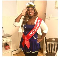 a woman in a sailor costume posing for the camera