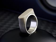 Gray concrete specially developed in our workshop between matte titanium. Our ring exudes undeniable modernity, making elevated style look anything but ordinary. Available engraving. Available in sizes 8 - 13. Custom sizes are available upon request, please email hello@loretorings.com for details. -- SPECIFICATIONS -- Materials: Titanium/ Gray Concrete Dimensions: 9mm x 1.9mm Lead time: 3-10 business days + shipping Shipping: We ship throughout DHL. We do not deliver to PO Boxes or APO/FPO addre Modern Titanium Ring, Modern Silver Titanium Rings, Men Masculine, Concrete Ring, Gray Concrete, Masculine Design, Elevated Style, Jewelry For Men, One Ring