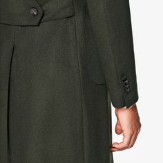 This classic green Lavello Patch overcoat is tailored to a slim fit from pure wool and features a broad peak lapel, patch pockets, and a martingale in the back. Green Long Coat With Double Button Closure, Fitted Dark Green Winter Outerwear, Green Long Pea Coat With Button Closure, Classic Green Outerwear With Double Button Closure, Green Formal Outerwear With Buttons, Green Single Breasted Outerwear With Lapel Collar, Classic Green Double-breasted Pea Coat, Green Double-breasted Pea Coat With Button Closure, Green Outerwear With Button Closure For Business