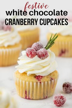 white chocolate cranberry cupcakes are topped with whipped cream and fresh berries