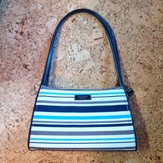 Kate Spade Mini Fabric Shoulder Bag, With Light Blue, Navy, And Brown Stripes On A Beige Background. Double Handles, Full Top Zip Closure, Inside Zip Pocket, And Inner Credit Card Slot. Features Metal Bottom Feet And Leather Handles. Measures 9.5 Inches Long, 5.5 Inches High, And 2.5 Inches Deep With An 8.25 Handle Drop. New. Trendy Blue Kate Spade Bag, Kate Spade Casual Satchel Bag, Casual Brown Kate Spade Bag, Casual Kate Spade Shoulder Bag, Fabric Handbags, Dream Style, Navy And Brown, Beige Background, Leather Handles