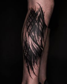 a man's leg with black ink on it