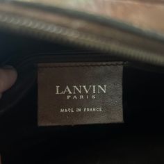 1980s Lanvin canvas logo crossbody bag in rich chocolate brown. Lanvin logo in brown leather at front. Long 26 inch brown leather adjustable strap and brass logo hardware. Made in France. Brown Business Bag With Logo, Lanvin Bags Handbags, Brown Logo Crossbody Bag, Lanvin Pencil Bag, Lanvin Happy Bag, Lanvin Alber Elbaz, Chocolate Brown, Lanvin, Adjustable Straps