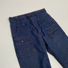 "Levis bush pants Childrens size 23\" waist cut off legs measure 9\" inseam Very cool only because theyre bush pants." Vintage High Waist Denim Cargo Jeans, Vintage High-waist Denim Cargo Jeans, Retro High Waist Cargo Jeans With Pockets, Retro High Waist Cargo Jeans, Retro High-waist Cargo Jeans With Pockets, Fitted Denim Cargo Pants With Belt Loops, Retro Straight Leg Bottoms With Cargo Pockets, Retro Full-length Bottoms With Cargo Pockets, Retro Wide-leg Bottoms With Patch Pockets