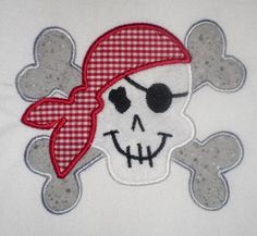 a skull with a red bandana on it's head and crossbones