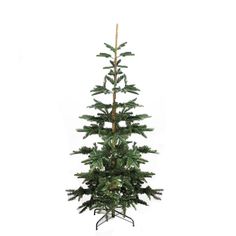 a small christmas tree on a stand against a white background