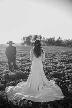 black and white photograph of a couple in a field