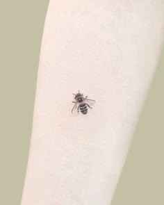 a small insect on the back of a woman's arm