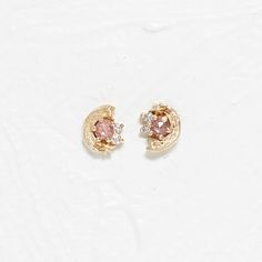 Material: 14K Solid Recycled Gold Center Stone: Pink Rose Cut Sapphire 2mm 1pc 0.03ctw G/H VS-SI White Round Diamond 1.2mm 1pc 0.0105ctw G/H VS-SI White Round Diamond 1mm 1pc 0.0065ctw Total length 5.8 x 4.8mm Pink Earring, Pink Earrings, The Grace, Recycled Gold, G H, White Diamonds, Rose Cut, Round Diamond, Pink Rose