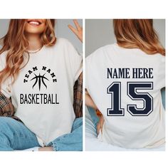 PERSONALIZED Basketball Shirt,Custom Name Number Basketball Shirt,Gift For Basketball Lover,Basketball Mama,Basketball Player Gift,Sport tee, Basketball Tee for Mom Dad Nana, Basketball Season Shirt, Sports Mom Tee, Basketball Game Day Shirt Beautiful artwork for all Basketball lover   This tee is the cutest gift for baseball mom, Basketball dad, Basketball nana, Basketball sister and a great gift idea for  Basketball Game Day, Basketball Season, Birthday gifts, family photos and pictures. 👉HOW TO ORDER👈 1️⃣ Please review all the information provided before placing an order 2️⃣ Select the shirt type and size using the drop down menu. 3️⃣ Select the color of the shirt using the following drop down menu. 4️⃣ Need more Items? Add the current item in the cart. And If you like to add more ite Varsity Basketball Tops With Team Logo, Team-colored Tops With Team Logo For Basketball, Sporty Basketball Team Tops, Sporty Basketball Tops With Team Logo, White Short Sleeve Basketball T-shirt, Sporty Crew Neck Tops For Basketball, Basketball Team Name T-shirt For Sports Season, Basketball Team Spirit Tops With Team Logo, Collegiate Basketball T-shirt With Team Name