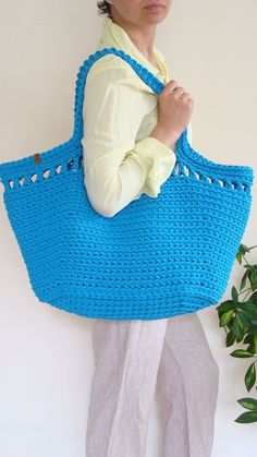 This huge crochet bag is a must-have for summer beach days. This lacey-accented boho chic basket bag goes great with a flimsy dress, short or long leggings, t-shirt, and sweater. It looks great as a summer accessory, beach bag, or everyday bag. It can accommodate books, beach gear, children's possessions, or groceries. Also makes a terrific gift! #custombasketbag #largetotebag #beachbag Bohemian Crochet Bag For Beach Shopping, Summer Beach Crochet Macrame Bag, Summer Crochet Macrame Bag For Everyday, Summer Macrame Crochet Bag, Summer Everyday Macrame Crochet Bag, Summer Everyday Crochet Macrame Bag, Everyday Summer Macrame Beach Bag, Eco-friendly Macrame Beach Bag For Summer, Eco-friendly Summer Beach Bag With Macrame