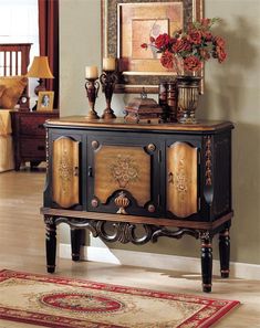 an ornate black and gold sideboard in a living room