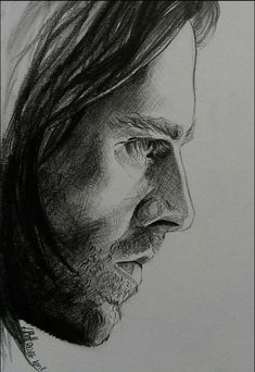 a drawing of a man with long hair and beards looking to his left side