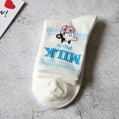 If you know South Korean culture, then you know it is customary to remove your shoes when entering a Korean household. With that in mind, Koreans love to sport stylish socks!These Fun Milk Flavor Design Crew Socks are no exception. Get your feet all cute and comfy with our breathable and sweat-absorbing flavored milk themed crew socks!• Color: Multicolor• Pattern Type: Milk• Composition: 70% Cotton, 25% Polyester, 5% Spandex• Material: Cotton Blends• Size: Women's EU35-40/US5-8.5• Type: Crew Socks• Socks Quantity: 1 pair per orderWe want you to be 100% satisfied, so please let us know if there is anything wrong with your order so we can fix it. Cute White Socks With Letter Print, Cute White Non-slip Socks, White Cotton Socks As A Gift, White Cotton Socks As Gift, White Cotton Socks For Gifts, Playful White Cotton Socks, White Non-slip Comfortable Socks, Comfortable Non-slip White Socks, Playful White Socks