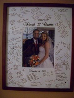 a wedding photo frame with autographs on it