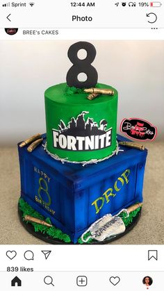 a birthday cake made to look like a fortnite box with the number 8 on top