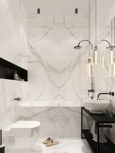 a bathroom with marble walls and flooring