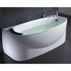 a white bath tub sitting on top of a black counter