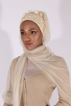 Complete your look with this stunning cream turban veil. Our Mystery in Cream Veil presents this magnificently embroidered turban to frame your face for a distinctive look. The one-piece turban veil is made especially for a simple yet classy fit that you can do yourself. The 58” long veil has a light cream shade to brighten up your dress.Whether it’s your wedding or engagement party, this turban veil will surprisingly shine up your special day and wow your guests.The turban's embroidery is based