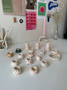 there are many ceramic objects on the table